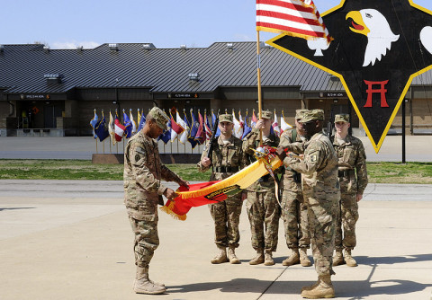 Col. Charles R. Hamilton and Command Sgt. Maj. Eugene Thomas, the command team of the 101st Sustainment Brigade, 101st Airborne Division (Air Assault), case the brigade colors, April 12, at Fort Campbell, Ky. The color casing ceremony is a time-honored tradition for units prior to deployment. (U.S. Army photo by Sgt. Leejay Lockhart)