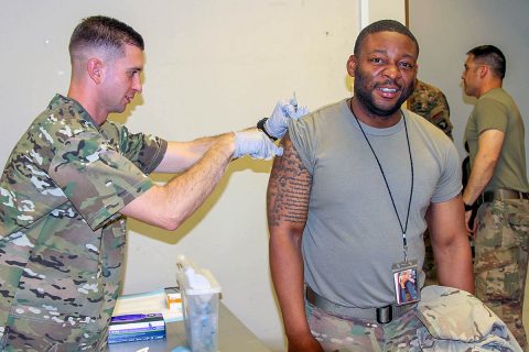 Specialist Phillip Pounders, a US Army combat medic assigned to the 101st Resolute Support Sustainment Brigade, inoculates Sgt. Michael Williams, an automated logistics specialist with the influenza vaccine at Bagram Airfield, Afghanistan, Oct. 17. (U.S. Army photo by Spc. Alexes Anderson) Specialist Phillip Pounders, a US Army combat medic assigned to the 101st Resolute Support Sustainment Brigade, inoculates Sgt. Michael Williams, an automated logistics specialist with the influenza vaccine at Bagram Airfield, Afghanistan, Oct. 17. (U.S. Army photo by Spc. Alexes Anderson)