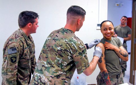 Specialist Phillip Pounders, a combat medic, assigned 101st Resolute Support Sustainment Brigade, inoculates Sgt. Brianna Sherpa, a construction equipment repair specialist, with the influenza vaccine at Bagram Airfield, Afghanistan, Oct. 17. (U.S. Army photo by Spc. Alexes Anderson) Specialist Phillip Pounders, a combat medic, assigned 101st Resolute Support Sustainment Brigade, inoculates Sgt. Brianna Sherpa, a construction equipment repair specialist, with the influenza vaccine at Bagram Airfield, Afghanistan, Oct. 17. (U.S. Army photo by Spc. Alexes Anderson)