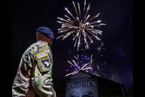 Sgt. 1st Class Rick Hurt, 1st Brigade Combat Team, 101st Airborne Division (Air Assault) honor guard, watches a firework display outside of the Belgium army Arlon barracks, Dec. 13. Nearly a million people converged on the city of Bastogne to celebrate the 75th anniversary of the Battle of the Bulge victory, fought and won, during World War II. (Pvt. John Simpson, 40th Public Affairs Detachment)