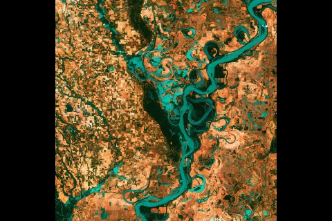 Small, blocky shapes of towns, fields, and pastures surround the meandering Mississippi River, the largest river system in North America in this Landsat image. (NASA's Goddard Space Flight Center/USGS) Small, blocky shapes of towns, fields, and pastures surround the meandering Mississippi River, the largest river system in North America in this Landsat image. (NASA's Goddard Space Flight Center/USGS)