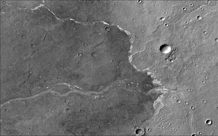 NASA's Mars Reconnaissance Orbiter used its Context Camera to capture this image of Bosporos Planum, a location on Mars. The white specks are salt deposits found within a dry channel. (NASA/JPL-Caltech/MSSS)