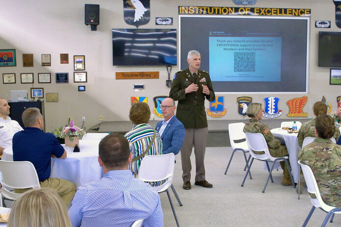 Col. Vincent B. Myers, commander, Blanchfield Army Community Hospital talks with TRICARE Network providers from the local community about the hospital's medical mission, April 13, during a network partner event on Fort Campbell, Kentucky. Regional TRICARE contractors provide healthcare services and support beyond what's available at military hospitals and clinics for eligible beneficiaries. (Fred Holly, Blanchfield Army Community Hospital)