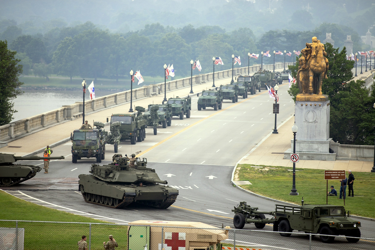 U.S. Army Soldiers, heavy equipment including M1A2 Abrams tanks, and light vehicles including light medium tactical vehicles merge as they prepare to march in the 250th Army Birthday Parade June 14, 2025, in Washington, D.C. The national level celebration included a day-long festival at the National Mall in Washington, D.C., a parade and a spectacular fireworks display. (U.S. Army photo by Sgt. 1st Class Rakeem Carter) U.S. Army Soldiers, heavy equipment including M1A2 Abrams tanks, and light vehicles including light medium tactical vehicles merge as they prepare to march in the 250th Army Birthday Parade June 14, 2025, in Washington, D.C. The national level celebration included a day-long festival at the National Mall in Washington, D.C., a parade and a spectacular fireworks display. (U.S. Army photo by Sgt. 1st Class Rakeem Carter)