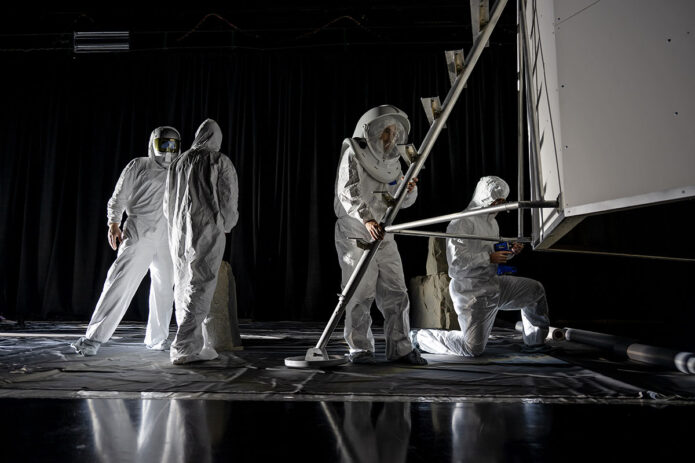 The Flat Floor Facility is an air-bearing floor, providing full-scale simulation capabilities for lunar surface systems by simulating zero gravity in two dimensions. Wearing low-fidelity materials, test engineers can understand how the extreme lighting of the Moon’s South Pole could affect surface operations during Artemis III. (NASA/Charles Beason)