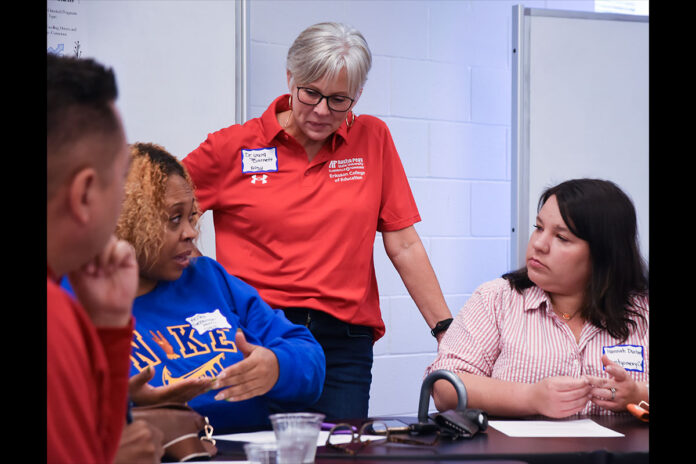Dr. Laura Barnett (center) discusses a leadership case study with Master of Arts in Education in educational leadership studies students at Austin Peay State University. This master’s program — now the first federally-registered principal apprenticeship in Tennessee — prepares students to serve as instructional leaders. (Megan Simpson, APSU)